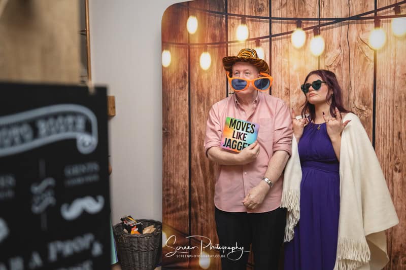 nottingham photo booth hire wooden boards backdrop with male female props